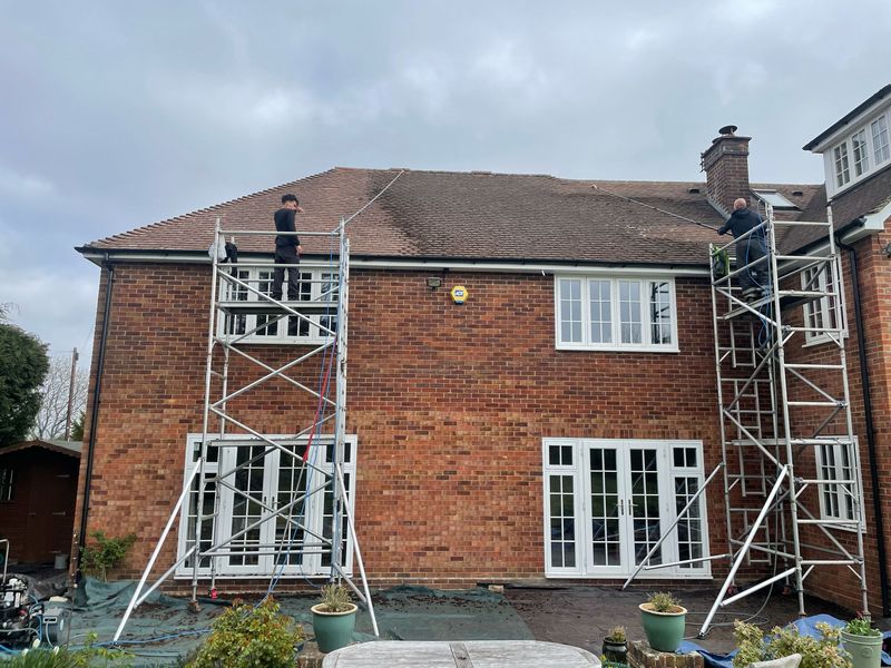 Roof cleaning carried out safely from scaffold towers by The Roof Moss Cleaners in Twyford